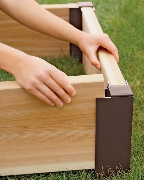 Cedar raised bed with aluminum corner being put together